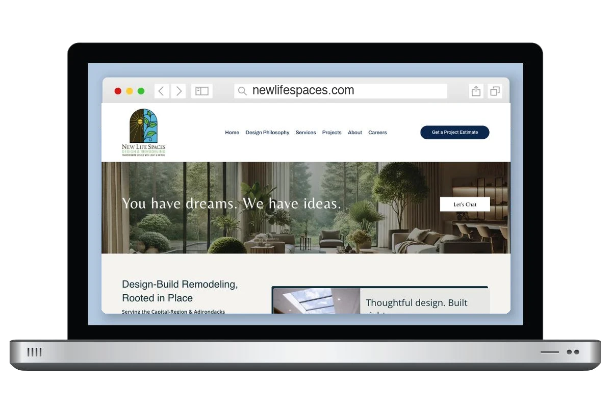 New Life Spaces design-build remodeling website shown on a laptop